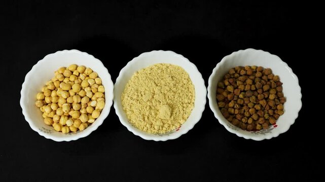 top view of roasted chickpea flour and chickpeas black gram in ceramic bowls