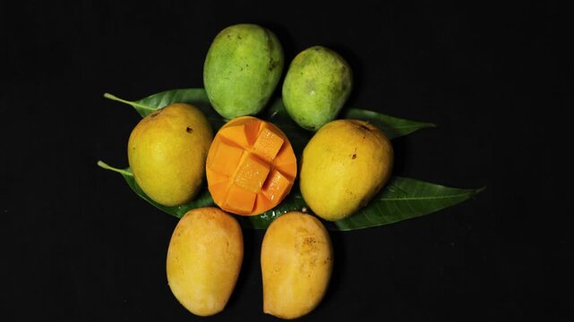 farm fresh variety of mango harvest with sliced mango and whole fruits top view
