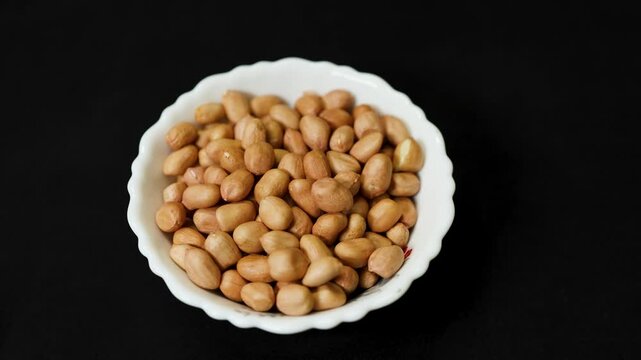 nutritious peanut kernels arranged in bowl highlighting natural snack and nutrition concept