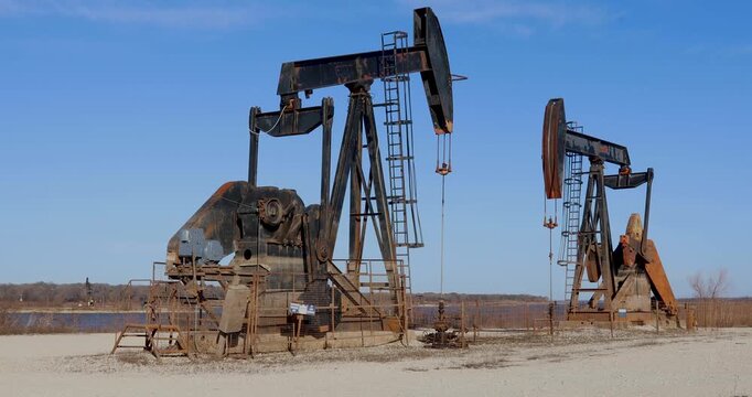 Static video of working oil derricks in the Hagerman National Wildlife Refuge in Sherman, Texas