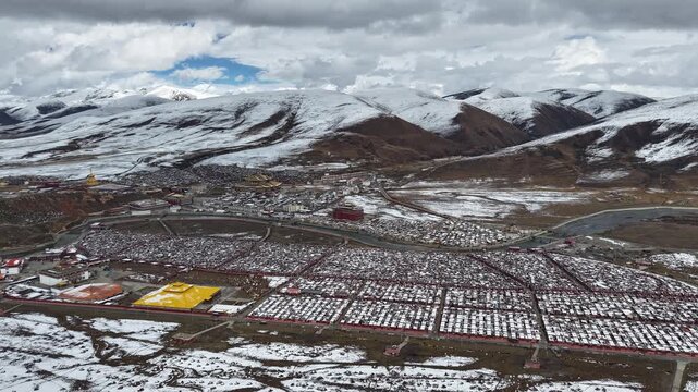 Hyperlapse Aerial of Yaqing Monastery (Yarchen gar) Amid Snowy Tibetan Plateau