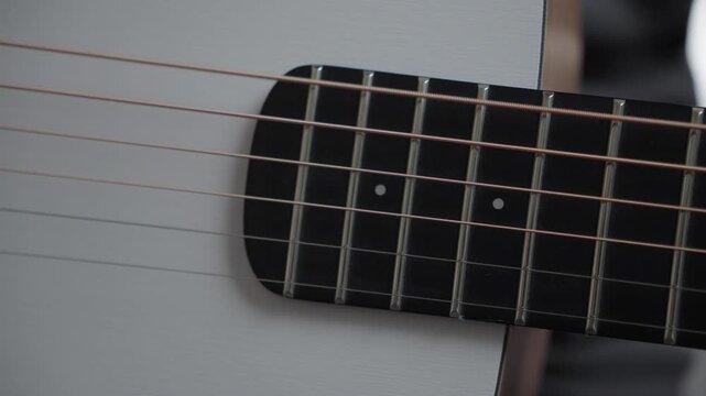 Close-Up of Single Guitar String Vibrating After Pick Strike