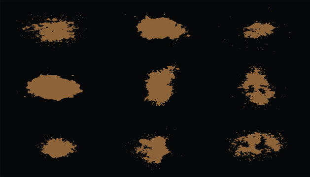 Collection of isolated brown grunge paint splatters, mud stains, and ink blots on a black background