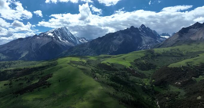 High altitude grassland and snow capped mountain in Sichuan, China