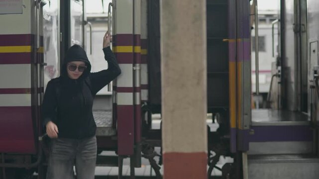 Traveling solo by train a female traveler at the railway station urban environment inspirational journey
