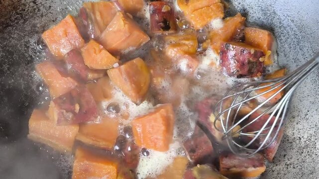 Boiling sweet potatoes in pan, indoor Chiangmai Thailand.