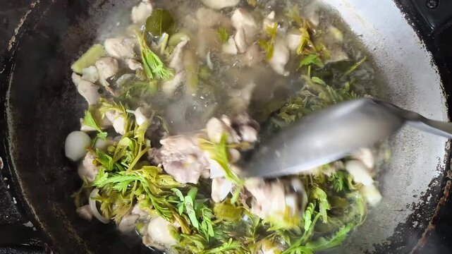 Cooking Tom Kha Gai in pan, Thai famous food.