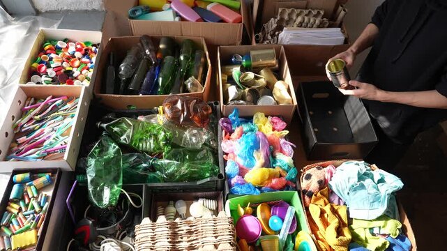Waste recycling. Sorting volunteer. Separation of collected waste into fractions