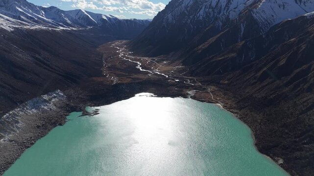 Drone Flyover of Glacier Lake Below Bujia Snow Mountain, Tibet