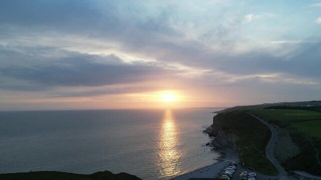 4K Static Aerial Drone Shot of Coastal Cliffs and Sunset Over the Sea at Ogmore‑by‑Sea, South Wales, United Kingdom