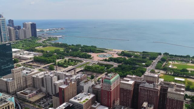 Chicago's downtown skyline overlooking Lake Michigan showing Buckingham Fountain, Millennium Park, Maggie Daley Park, Grant Park, lakefront buildings