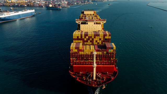 Large Container Ship Navigating Through The Busy Industrial Harbor Of Laem Chabang Chon Buri Thailand