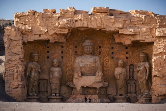 Buddha statues carved in sandstone cliff at Yungang Grottoes, Datong, China
