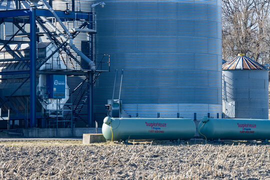 Quebec, Canada, 24 April 2026 : Grain silos and propane tanks stand next to a grain dryer at an agricultural facility.