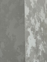 Textured gray wall with concrete pattern corner, suitable for background, interior design theme © dvoevnore