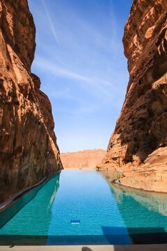 Infinity Pool Between Sandstone Cliffs in AlUla Desert, Saudi Arabia
