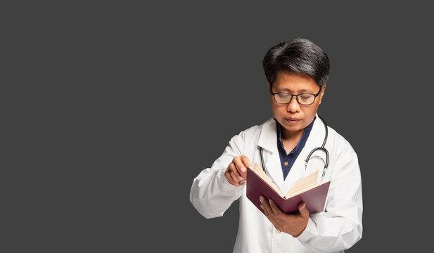 Female doctor reviewing information in notebook