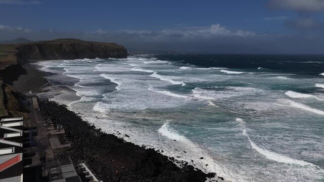 Drone shot of big ocean waves during strong swell in the Azores islands.