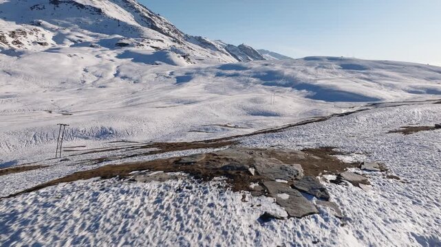 Rohtang Pass in Himachal Pradesh displays snow-covered terrain connecting Kullu Valley to Lahaul and Spiti regions. Smooth forward tracking shot reveals the high-altitude mountain pass at 3,980.