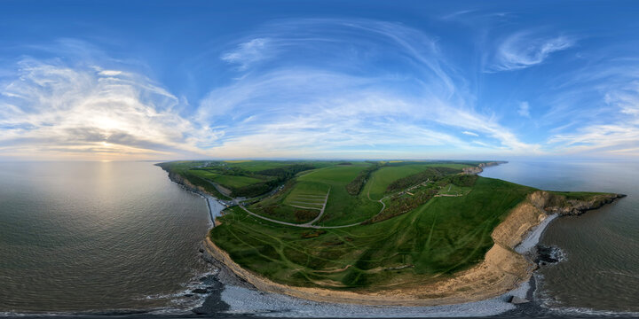 Sweeping 360&deg; Aerial View of Tranquil Coastline and Open Sky at Dunraven Bay, South Wales