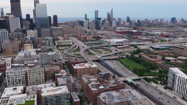 Elevated cityscape of Chicago with downtown skyline, highway interchange, urban infrastructure, transportation network from unique tripod perspective