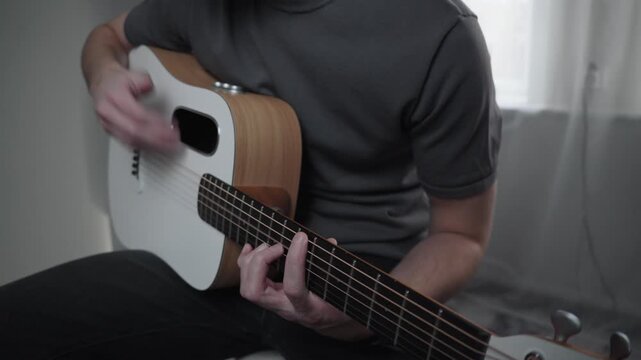 Medium Shot of Man Playing Acoustic Guitar at Home