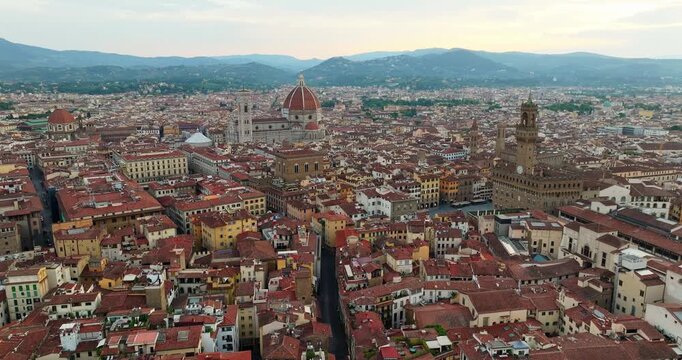 Florence historic centre panorama Duomo Palazzo Vecchio terracotta rooftops Tuscany Italy aerial view slow motion travel tourism Renaissance cityscape landmark dusk Firenze 