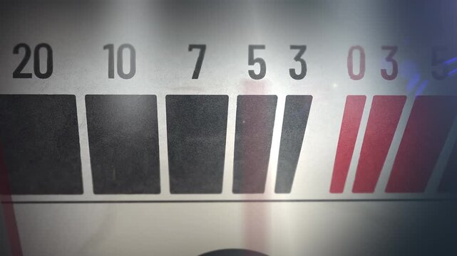 Horizontal macro shot of an analog VU meter needle sweeping the decibel scale toward the red zone, glowing vintage hi-fi amplifier mood for music and audio branding