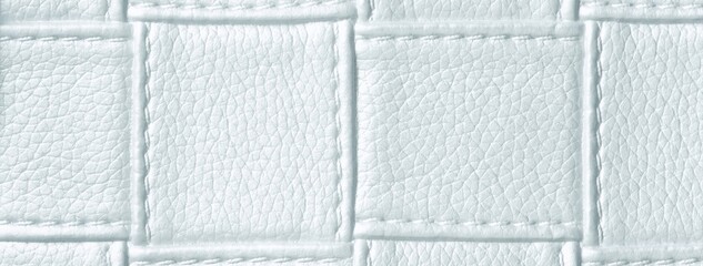 Naklejka premium Texture cool white leather background with quilted stitched pattern, macro. Abstract ivory upholstery surface