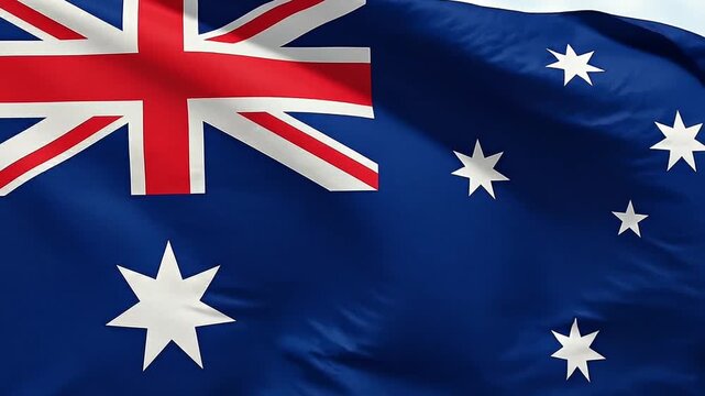 Close up of the Australian flag waving in the wind with detailed fabric texture and bright colors