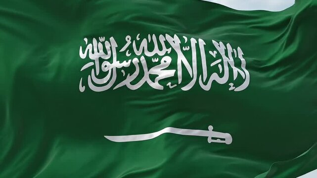 Waving Saudi Arabia flag with Shahada inscription and sword in white on green fabric background, national symbol of the Kingdom