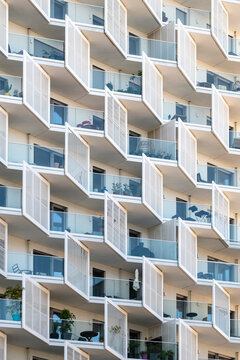 repeating balconies define an apartment building facade in Nordbahnviertel Vienna Austria where windows and shadows create housing geometry