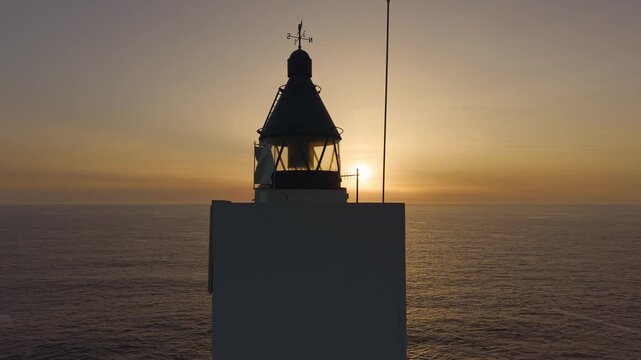 Faro de Meir&aacute;s Against Sunset Sky Beach On The Coastline Of Valdovi&ntilde;o In Galicia, Spain. Aerial Close-up Shot