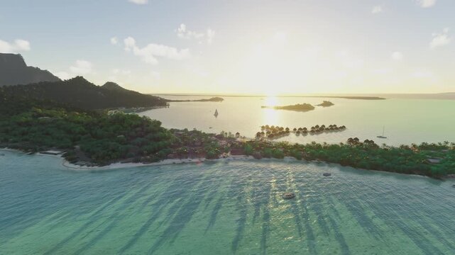 Side aerial drone view of Matira Beach in Bora Bora. French Polynesia