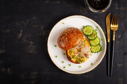 Savory Breakfast Burger with Scrambled Eggs and Escolar. Top view