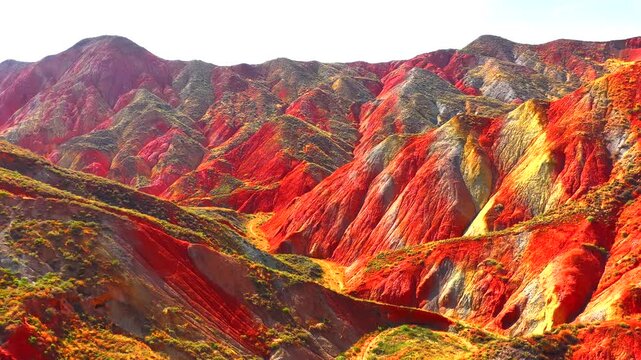 Aerial view, Cinematic drone, Zhangye Danxia, Lanzhou Danxia, Rainbow mountains, Colorful rock formations, Layered stratigraphy, Desert landscape, Canyon texture, Erosion patterns, Geological wonder,