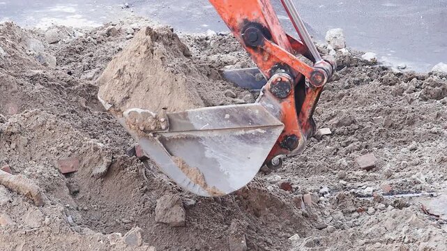 Construction Excavator Moving Soil for City Utility Maintenance