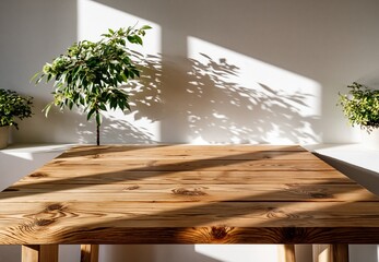 Obraz premium Rustic Wooden Table Surface with Sunlight Shadows and Green Plants Indoor