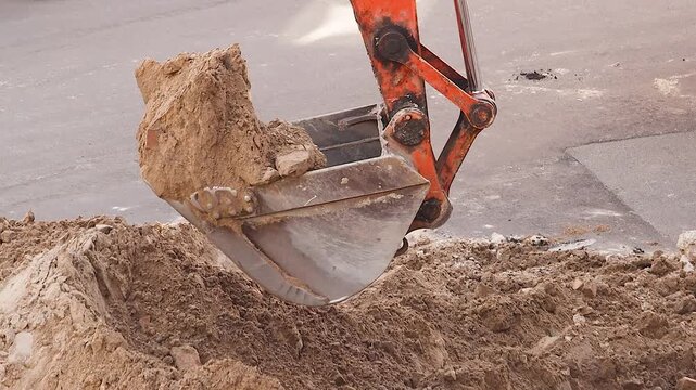 Excavator Bucket Digging Trench for Urban Infrastructure Renewal