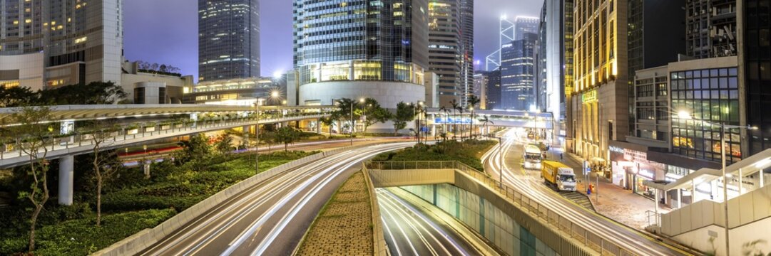 Hong Kong at night traffic with streets and skyscrapers panorama in Hong Kong, China