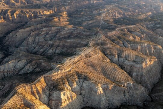 Sunrise, wide hilly desert landscape with dry vegetation, Gorafe desert, semi-desert, Granada, Andalusia, Spain