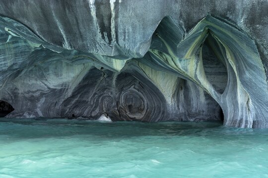 Marble caves with curved rock formations over turquoise water, Capillas de M&aacute;rmol, General Carrera Lake, Ays&eacute;n region, Chile