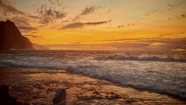 Ocean sunset with warm orange sky and calm waves, romantic, Ponta do Sol, Santo Antao, Cabo Verde, Cape Verde, Cape Verde