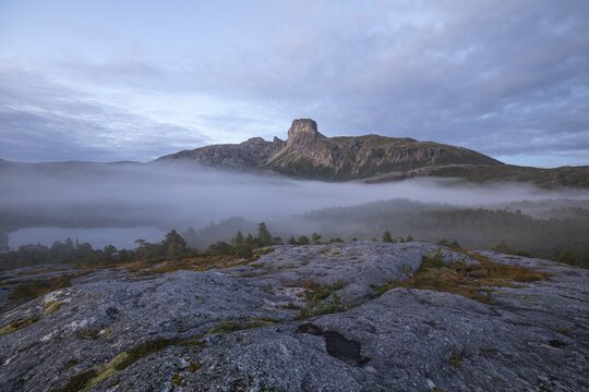 Magical morning fog on Steigtindvatnet in front of the majestic Steigtinden in Norway near Bod&oslash;
