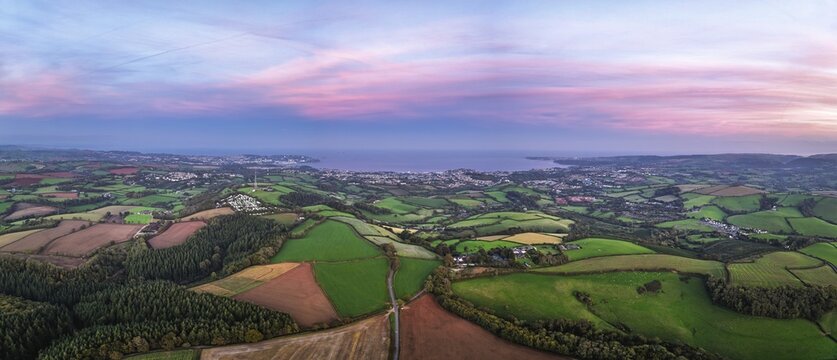 Twilight Sky of Torbay farms and fields from a drone, Totnes, Berry Pomeroy, Devon, England, United Kingdom