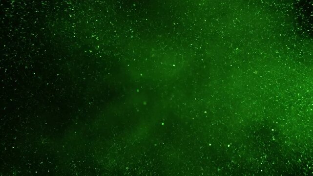 Abstract Green Smoke and Particles on Black Background.