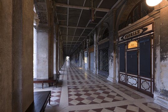 Empty arcades of the Old Procuration, 16th century, St. Mark's Square early in the morning Venice, Veneto, Italy