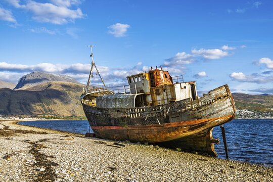 Corpach Wreck or Old Boat of Caol and Nevis Range Mountains, Caol Beach, Corpach, Fort William, Highland, Scotland, UK