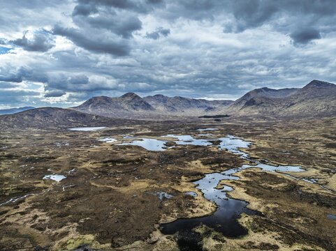 Rannoch Moor from a drone over Loch Ba and Loch of the Armpit, A82 Highland Way, Argyll and Bute, West Highlands, Scotland, United Kingdom