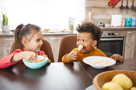 Joyful family meal time in a cozy kitchen setting